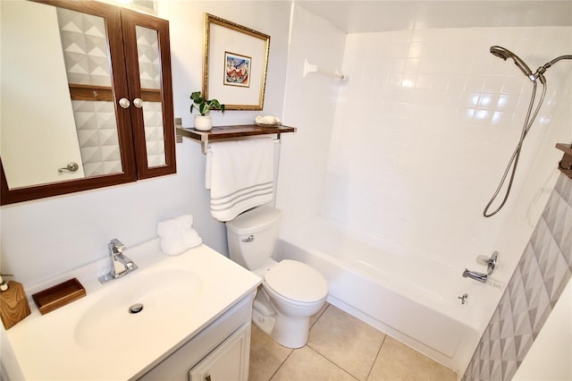 full bathroom featuring tile patterned flooring, tiled shower / bath combo, toilet, and vanity