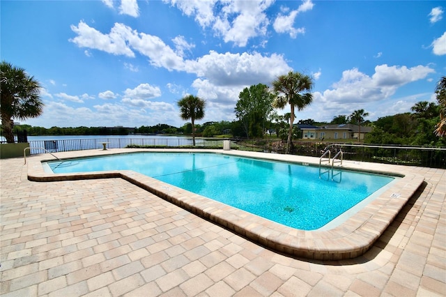 view of swimming pool featuring a patio area