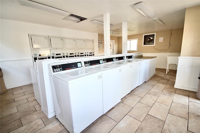 laundry room featuring stacked washer / dryer and washer and dryer