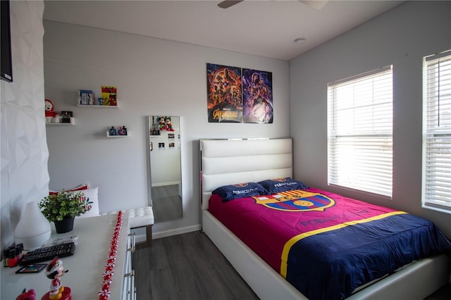 881 Orchid Grove Blvd, Davenport, FL 33837 - bedroom with dark wood finished floors and a ceiling fan