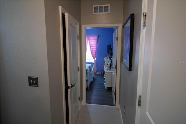 881 Orchid Grove Blvd, Davenport, FL 33837 - corridor with tile patterned floors and a textured wall