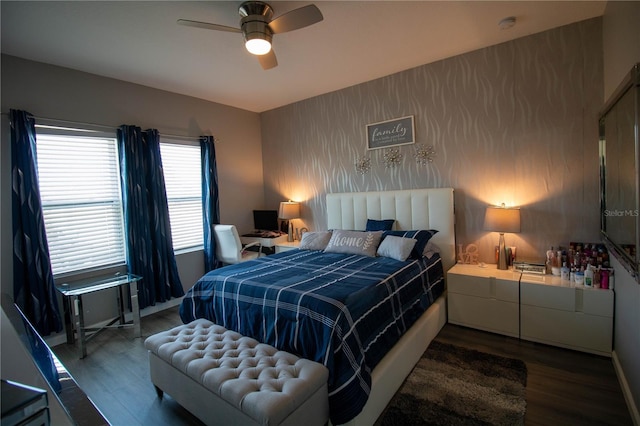 881 Orchid Grove Blvd, Davenport, FL 33837 - bedroom with wood finished floors, an accent wall, and ceiling fan