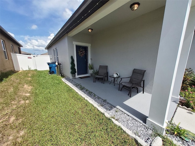 881 Orchid Grove Blvd, Davenport, FL 33837 - rear view of house with stucco siding and a patio area
