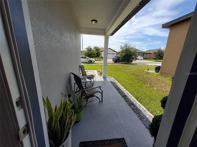 881 Orchid Grove Blvd, Davenport, FL 33837 - covered porch featuring a yard