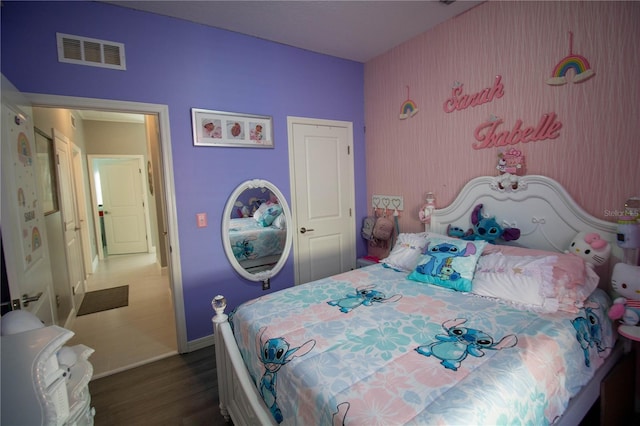 881 Orchid Grove Blvd, Davenport, FL 33837 - bedroom with baseboards and wood finished floors