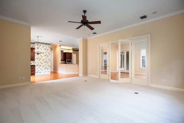 unfurnished living room with light colored carpet, ceiling fan, and crown molding