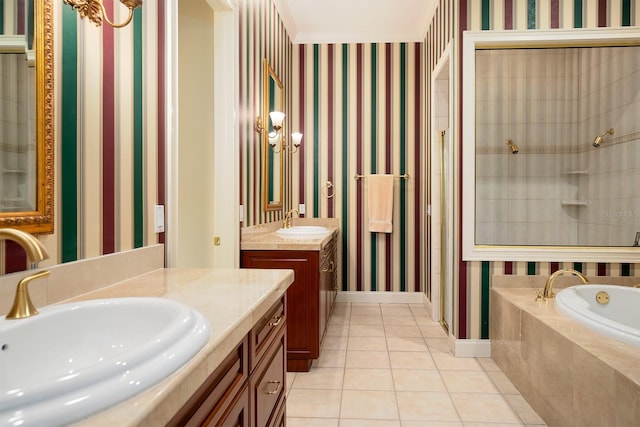 bathroom featuring vanity, tile patterned floors, crown molding, and tiled tub