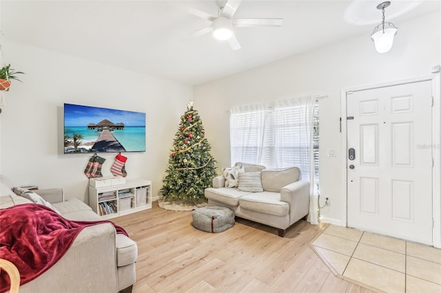 living room with hardwood / wood-style floors and ceiling fan