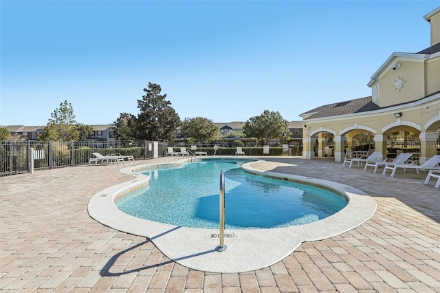 view of swimming pool with a patio