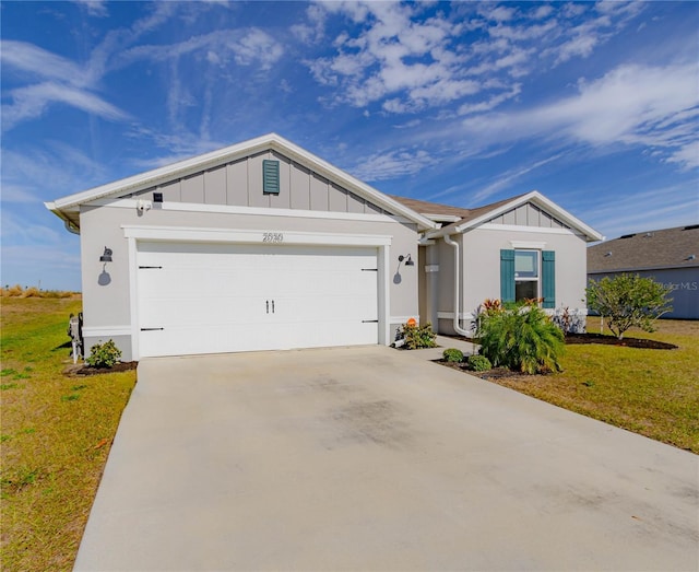 ranch-style house with a garage and a front lawn