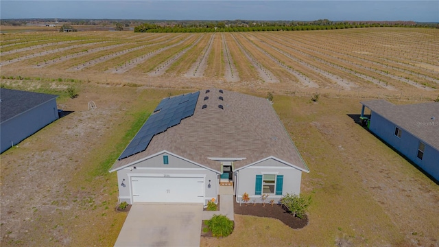 birds eye view of property featuring a rural view