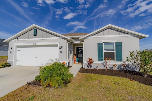 ranch-style home with a garage and a front lawn