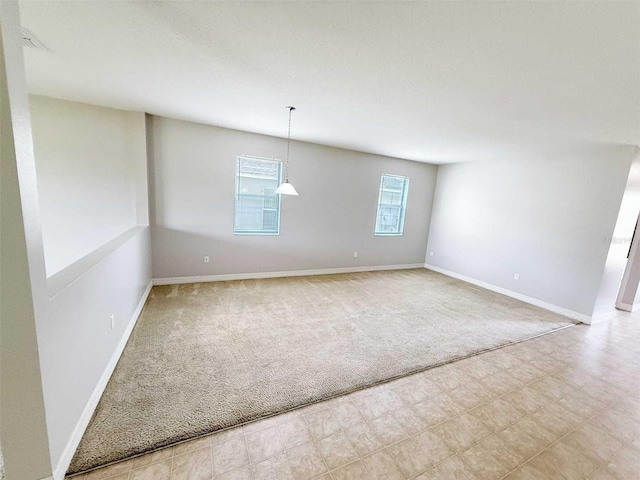 1208 Sawgrass Pointe Dr, Orlando, FL 32824 - empty room featuring baseboards and carpet floors
