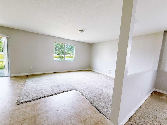 1208 Sawgrass Pointe Dr, Orlando, FL 32824 - spare room featuring carpet and baseboards