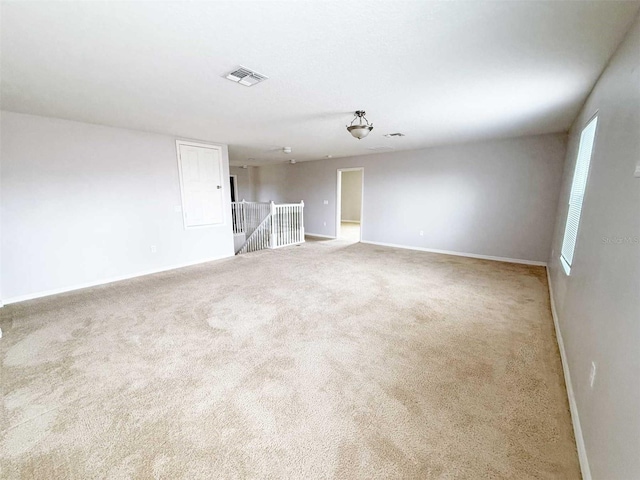 1208 Sawgrass Pointe Dr, Orlando, FL 32824 - unfurnished room featuring baseboards, visible vents, and carpet floors