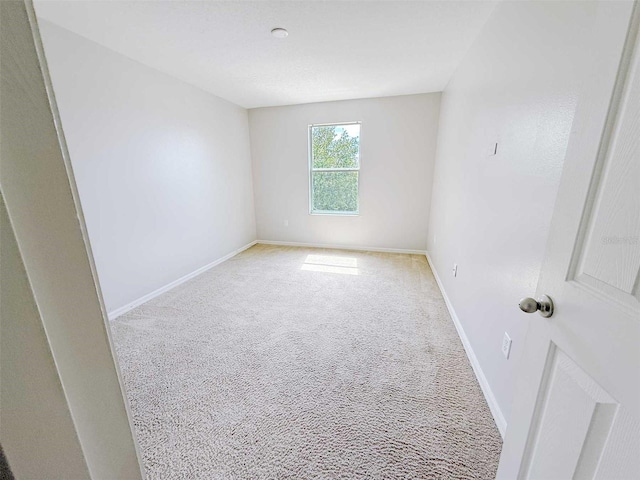 1208 Sawgrass Pointe Dr, Orlando, FL 32824 - carpeted empty room with baseboards