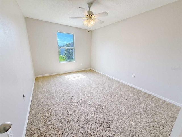 1208 Sawgrass Pointe Dr, Orlando, FL 32824 - spare room with ceiling fan, baseboards, and carpet floors