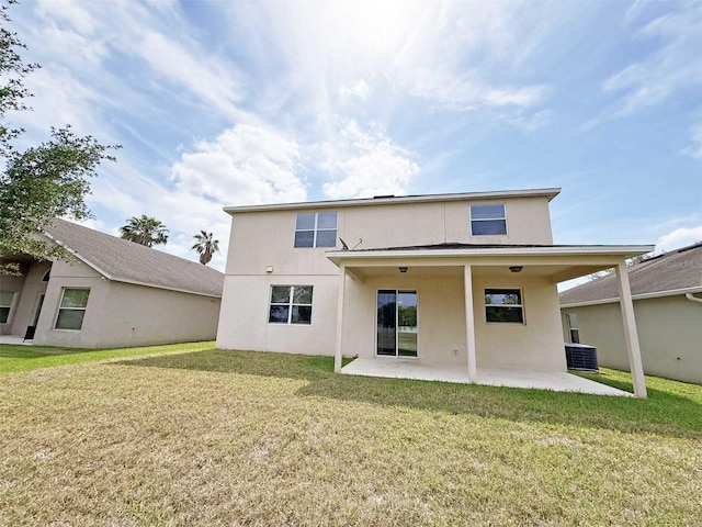 1208 Sawgrass Pointe Dr, Orlando, FL 32824 - rear view of property with a lawn, a patio area, central AC unit, and stucco siding