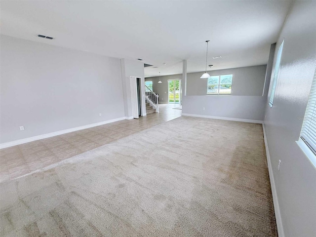 1208 Sawgrass Pointe Dr, Orlando, FL 32824 - spare room featuring carpet, baseboards, and visible vents