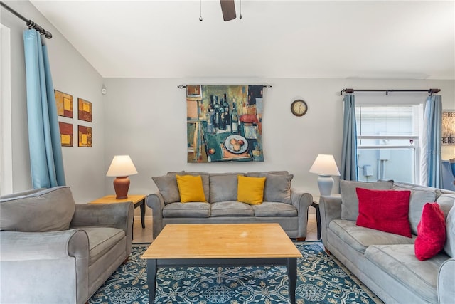 living room with ceiling fan and vaulted ceiling