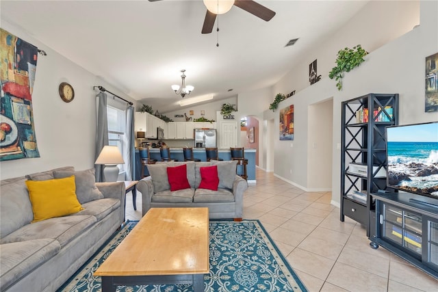 living room featuring light tile patterned floors, ceiling fan with notable chandelier, and vaulted ceiling