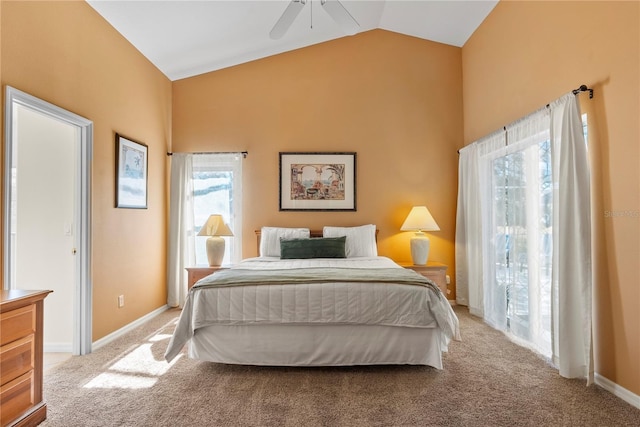 bedroom featuring ceiling fan, light colored carpet, and vaulted ceiling