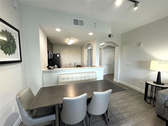 dining space featuring dark hardwood / wood-style floors