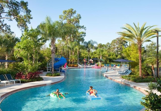 view of swimming pool featuring a water slide