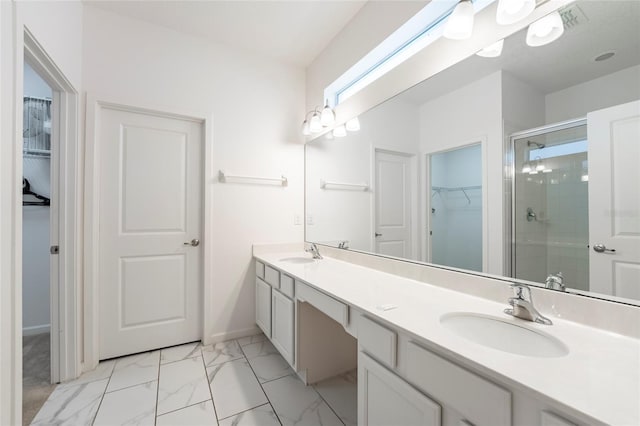 bathroom featuring vanity and a shower with door