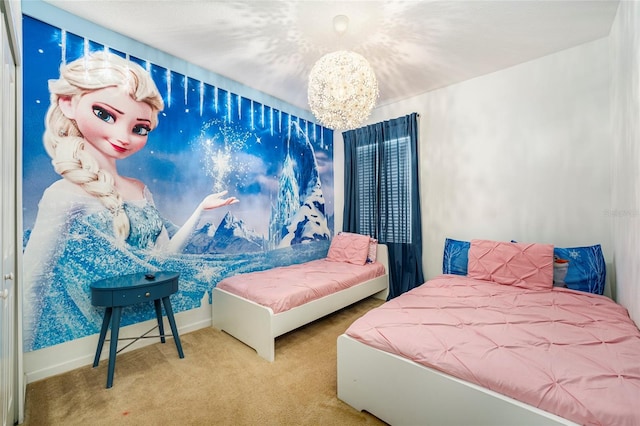 carpeted bedroom featuring an inviting chandelier