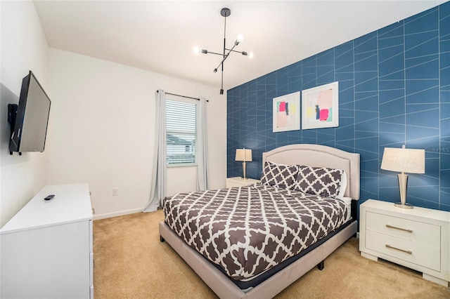 bedroom with light carpet, tile walls, and an inviting chandelier