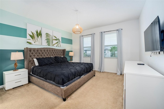 bedroom with light colored carpet