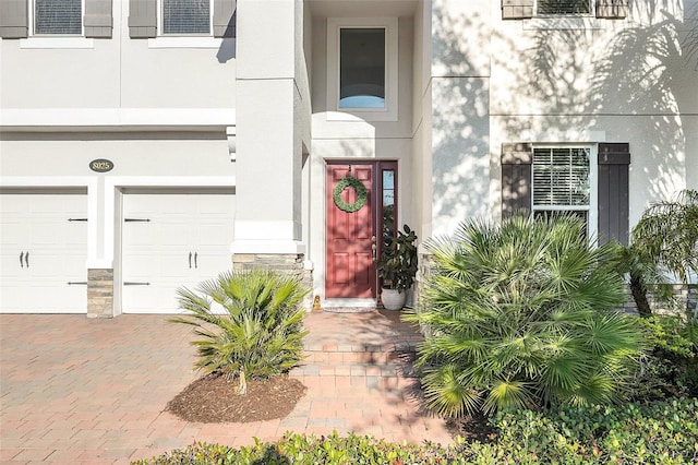 entrance to property featuring a garage