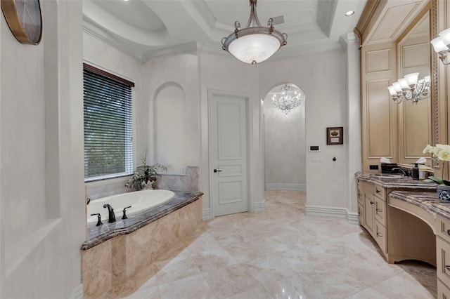 bathroom featuring tiled bath, crown molding, vanity, and an inviting chandelier