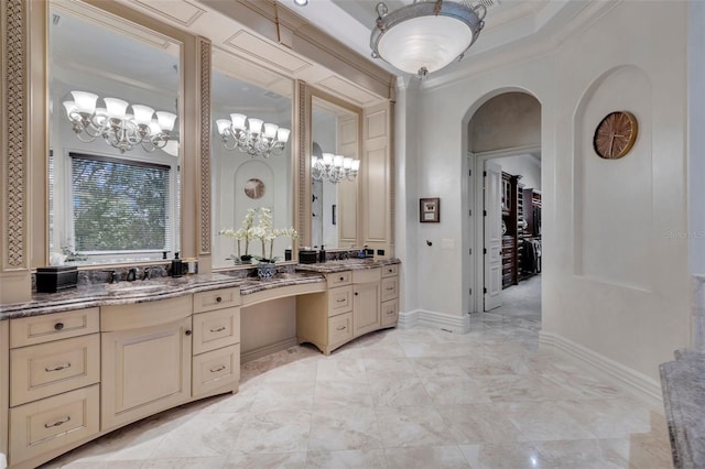 bathroom featuring crown molding and vanity