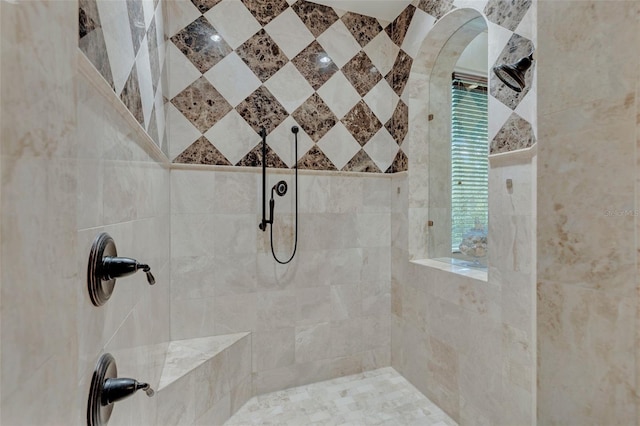 bathroom featuring tiled shower