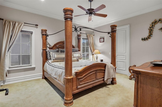 carpeted bedroom featuring ceiling fan and ornamental molding