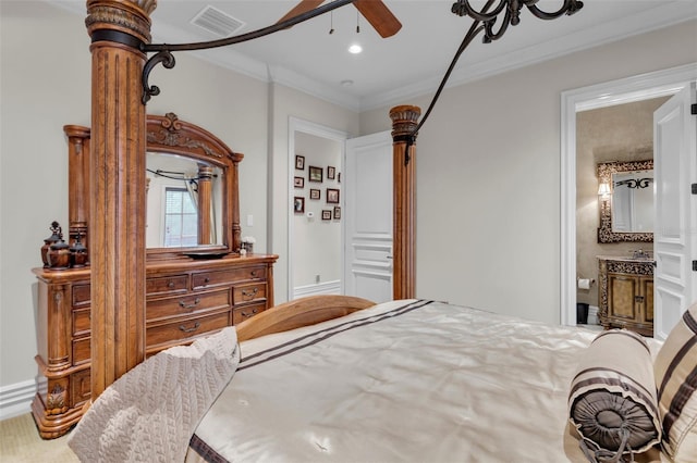 bedroom featuring ensuite bathroom and crown molding