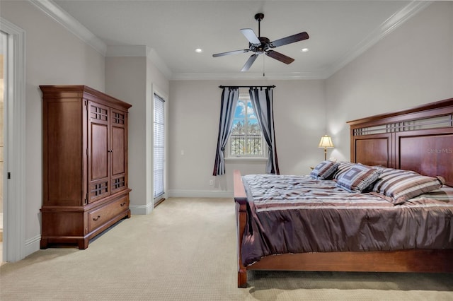 carpeted bedroom featuring ceiling fan and ornamental molding