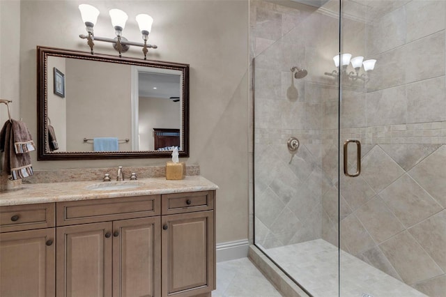 bathroom featuring tile patterned floors, vanity, and a shower with shower door