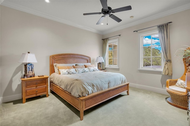 carpeted bedroom with ceiling fan and ornamental molding