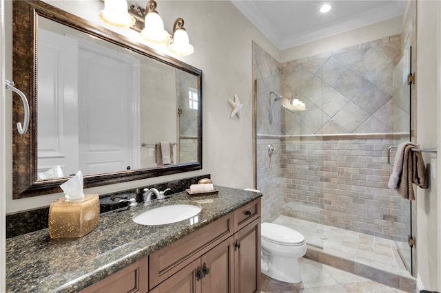 bathroom with vanity, tile patterned floors, crown molding, toilet, and a shower with shower door