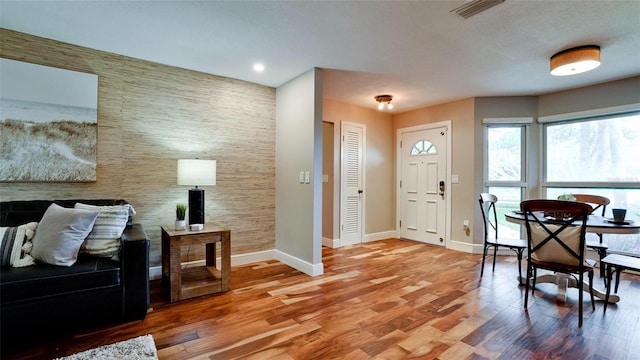 foyer entrance with hardwood / wood-style floors