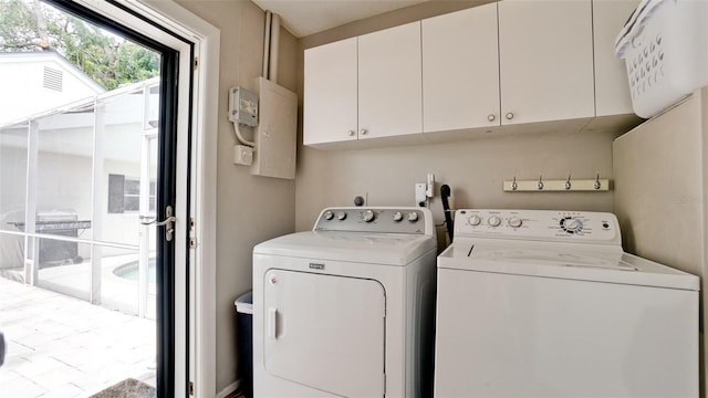 laundry area featuring cabinets and washing machine and dryer