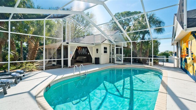 view of pool featuring a lanai and a patio