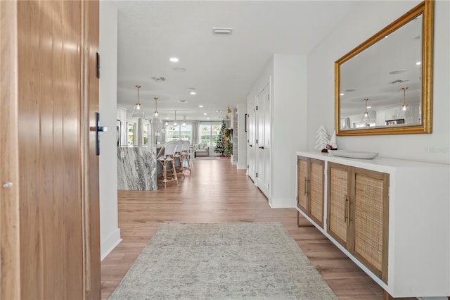 hallway featuring light wood-type flooring