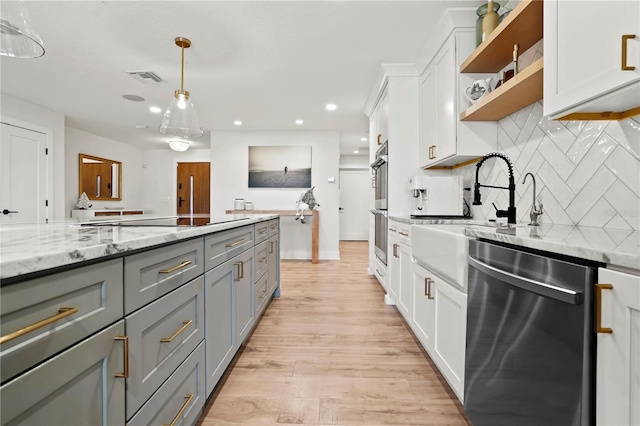 kitchen with white cabinets, gray cabinets, and stainless steel appliances