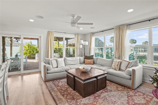 sunroom featuring ceiling fan