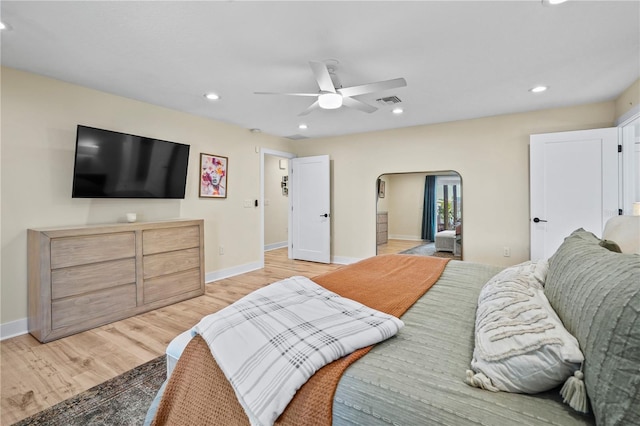 bedroom with ceiling fan and light hardwood / wood-style flooring