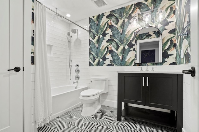 full bathroom with toilet, vanity, tile patterned flooring, and shower / bath combo